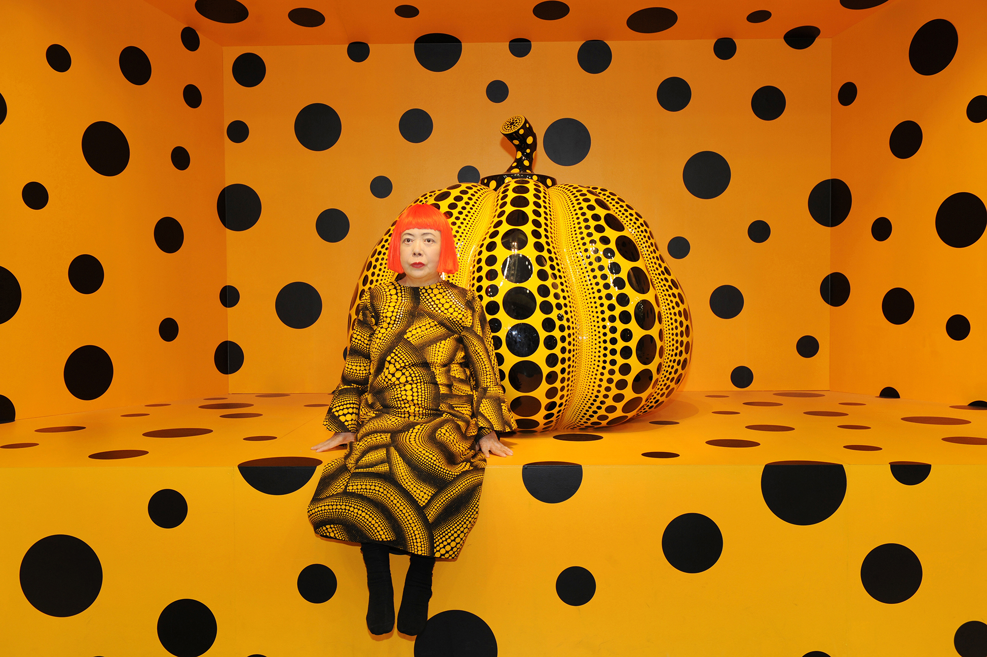 Kusama with PUMPKIN - 2010 Courtesy Ota Fine Arts, David Zwirner, and Victoria Miro © YAYOI KUSAMA